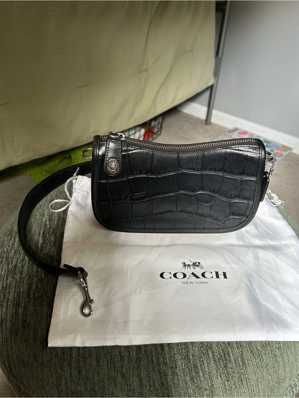 Coach Swinger Bag
Black Croc-Embossed Mini Shoulder Bag with Silver Hardware - Picture 5 of 7